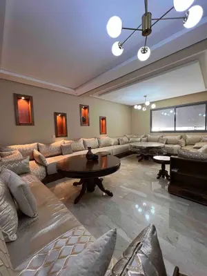 a large living room with couches and a table at Appartment Maarif proche toutes commoditées in Casablanca