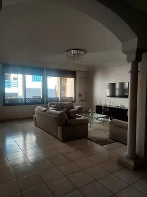 a living room with two couches and a table at Appartement Familial Casablanca in Casablanca
