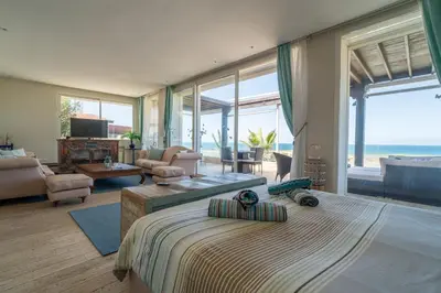 a bedroom with a large bed with a view of the ocean at Skhirat Oceanfront Villa 5 Bedrooms Direct Beach Access in Skhirat