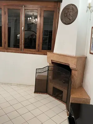 a room with a fireplace and a wooden cabinet at \u9526\u9ca4JinLi Villa 21 in Casablanca