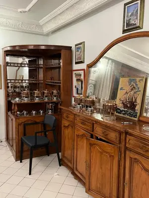 a room with a chair and a table with glasses at \u9526\u9ca4JinLi Villa 21 in Casablanca