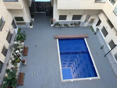an overhead view of a swimming pool in a building at Studio Stade Morocco for family in Mohammedia