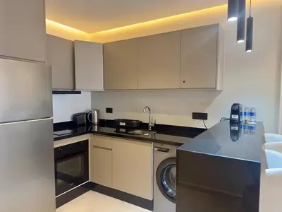 a kitchen with a sink and a dishwasher at Luxurious & Central Princesses in Casablanca