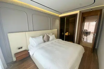 a bedroom with a large white bed in it at Elegant apartment - Princesses in Casablanca