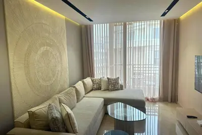 a living room with a couch and a glass table at Elegant apartment - Princesses in Casablanca