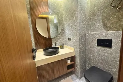 a bathroom with a sink and a mirror at Elegant apartment - Princesses in Casablanca