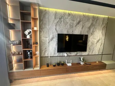 a living room with a television on a wall at Luxurious studio for princesses in Casablanca