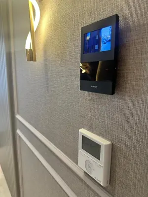 a tv on a wall with a computer monitor at Luxurious studio for princesses in Casablanca