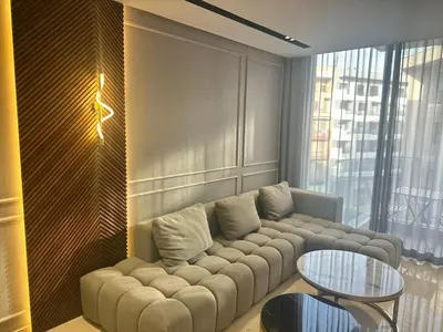 a living room with a couch and a table at Luxurious studio for princesses in Casablanca