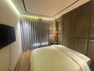 a bedroom with a white bed and a window at Luxurious studio for princesses in Casablanca