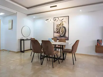 a dining room with a table and chairs at Travel and Leisure - By AppartAli in Casablanca