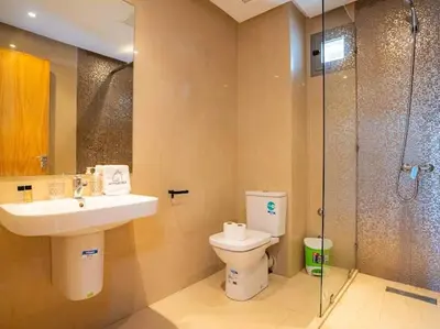 a bathroom with a toilet and a sink and a shower at Casa Contemporary 3 Beds - By AppartAli in Casablanca