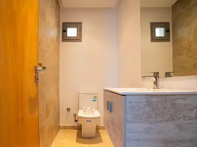 a bathroom with a toilet and a sink at Casa Contemporary 3 Beds - By AppartAli in Casablanca