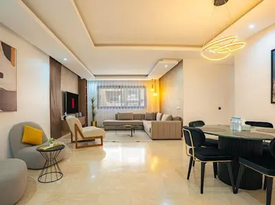 a living room with a couch and a table at Casablanca Breeze - By AppartAli in Casablanca