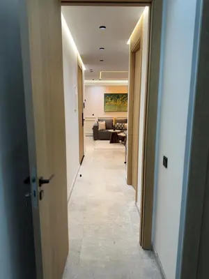 a hallway leading to a living room with a couch at Luxe studio plein centre ville in Casablanca
