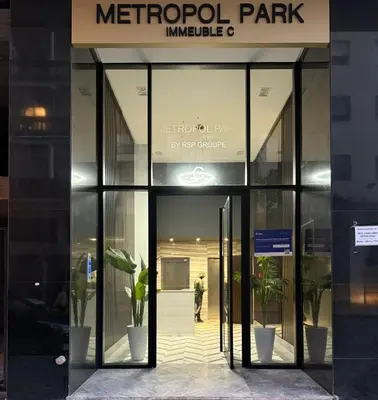 a person walking out of a metropole building at Luxe studio plein centre ville in Casablanca