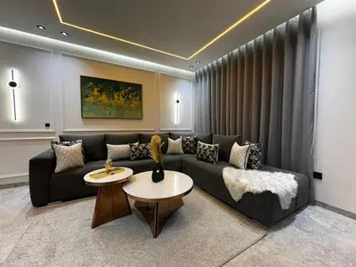 a living room with a couch and a table at Luxe studio plein centre ville in Casablanca