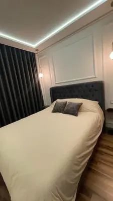 a bedroom with a bed with two pillows on it at Cozy apartment 2 bedrooms 2 bathrooms in Casablanca
