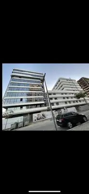 a car parked in front of two tall buildings at Studio Gironde in Casablanca
