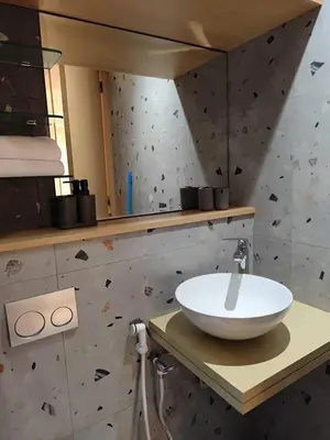 a bathroom with a white bowl sink on a counter at Studio Gironde in Casablanca