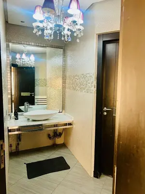 a bathroom with a sink and a large mirror at Waterfront Villa & Private Pool 12 km from the Stadium in Temara