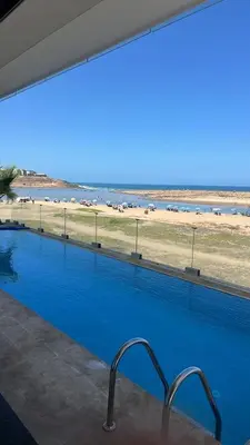 a swimming pool with a view of the beach at Waterfront Villa & Private Pool 12 km from the Stadium in Temara