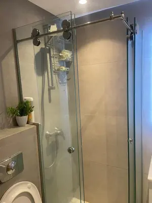 a shower stall in a bathroom with a toilet at Stay luxe in Casablanca