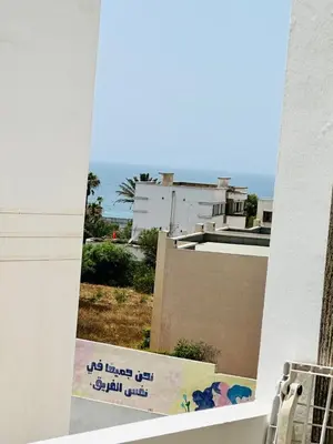 a view of the ocean from a window of a building at Stay luxe in Casablanca