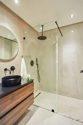 a bathroom with a sink and a shower at AFCON Casablanca 5 min Walk to Stadium Private Terrace 65 inch TV Fiber Internet All Sports Channels in Casablanca