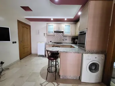 a kitchen with a counter and a dishwasher at wbdixmude in Casablanca