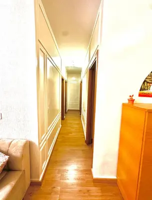 a long hallway with a couch in a room at Cozy appartement Rabat Wifak 5min de Harhoura beach in Temara