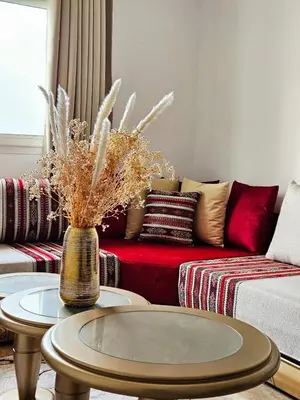 a living room with a couch and a table at Sunset Ocean View in Rabat