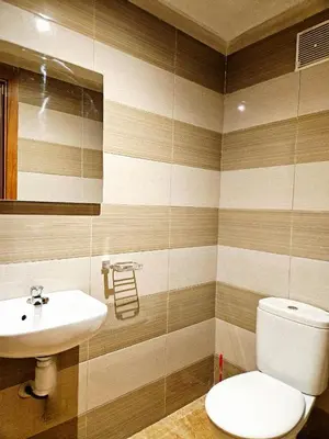 a bathroom with a toilet and a sink at Sunset Ocean View in Rabat