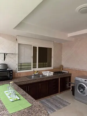 a kitchen with a sink and a counter top at Harhoura stay à 10min du stade Prince Moulay Abdellah ! in Temara