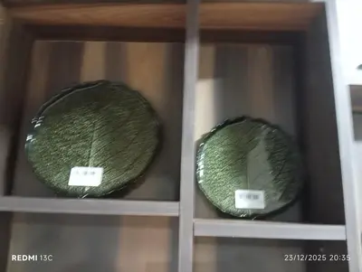 two green bowls are sitting on a shelf at Loge studio agdal in Rabat