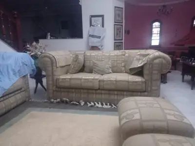 a living room with a couch and a table at 2 bedroom apartment and living room with small terrace in Skhirat