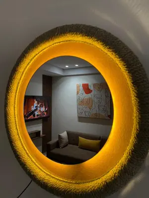 a yellow mirror in a living room with a couch at Cosy Loft with Sauna - City Center Casablanca in Casablanca
