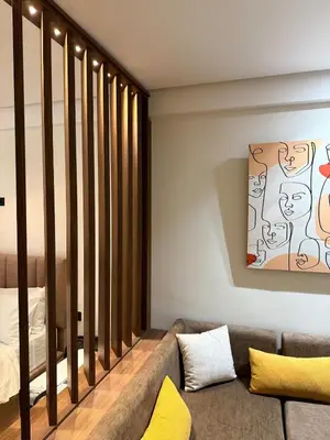 a living room with a couch and a bed at Cosy Loft with Sauna - City Center Casablanca in Casablanca