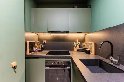 a kitchen with a sink and a stove at Studio moderne & cosy - CFC - Maarif in Casablanca