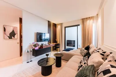 a living room with a couch and a table at Studio moderne & cosy - CFC - Maarif in Casablanca