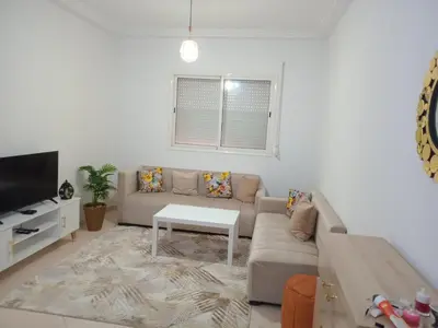 a living room with a couch and a table at Ouma in Casablanca