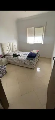 a bedroom with a bed and a window in it at Ouma in Casablanca