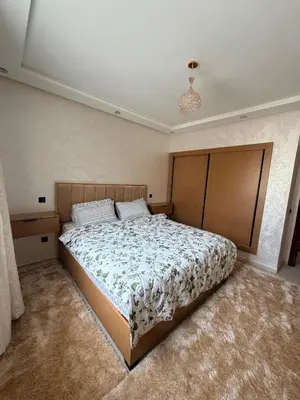 a bedroom with a large bed in a room at Beautiful Apartment for Rent in Corniche de Rabat in Rabat