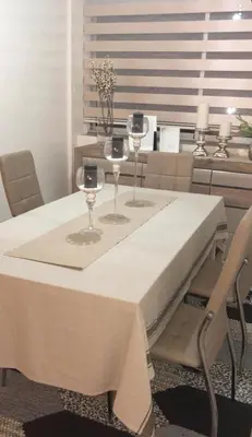 a table with two wine glasses on top of it at Sea view Apart Rabat in Rabat