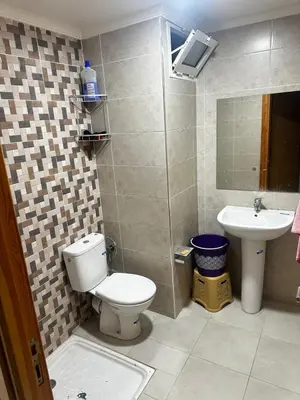 a bathroom with a toilet and a sink at Appartement central à Témara, trés proche de Rabat Av Tarik Ibn Zaid in Temara