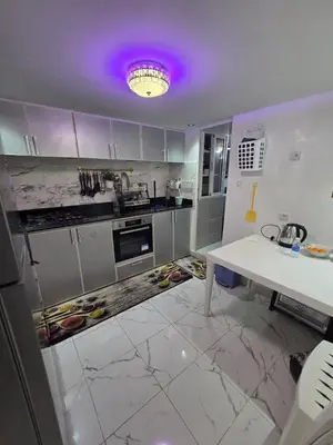 a kitchen with a white counter and a purple ceiling at Appartement meublée à RABAT for CAN 2025 in Temara