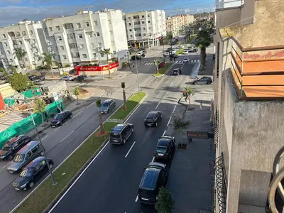 a view of a city with cars parked on a street at Appartement meublée à RABAT for CAN 2025 in Temara