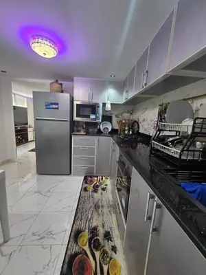 a kitchen with a counter with food on it at Appartement meublée à RABAT for CAN 2025 in Temara