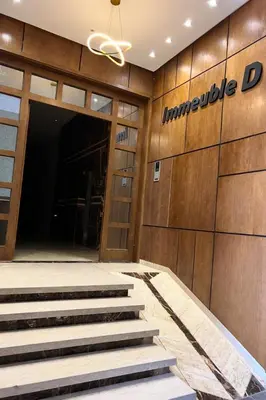 a lobby with stairs in front of a building at Studio Glamour centre ville & Casa port in Casablanca