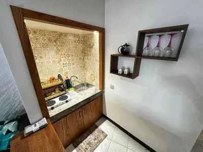 a small kitchen with a sink and a counter at Studio Premium à Agdal , Confort et emplacement in Rabat